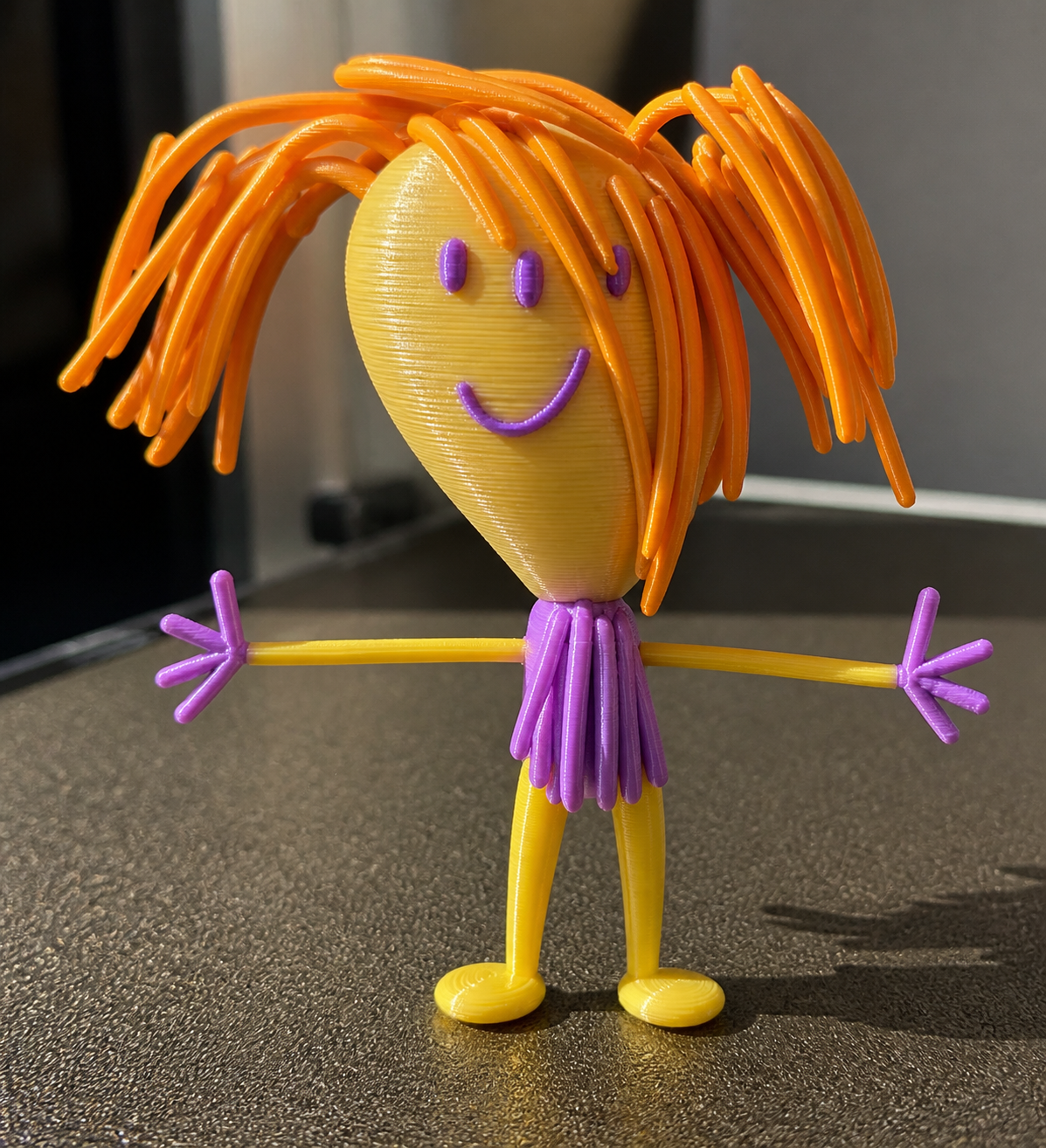 Orange-haired character transformed from a child’s drawing into a multicolour Artwork Figure